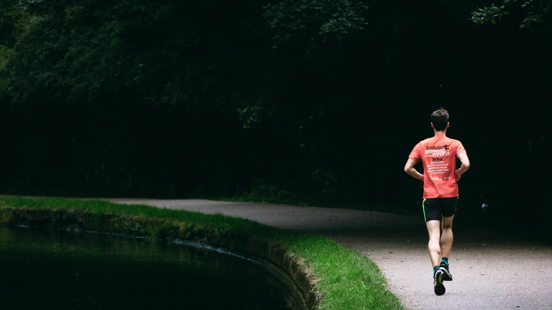 jogger on a path along a body of water