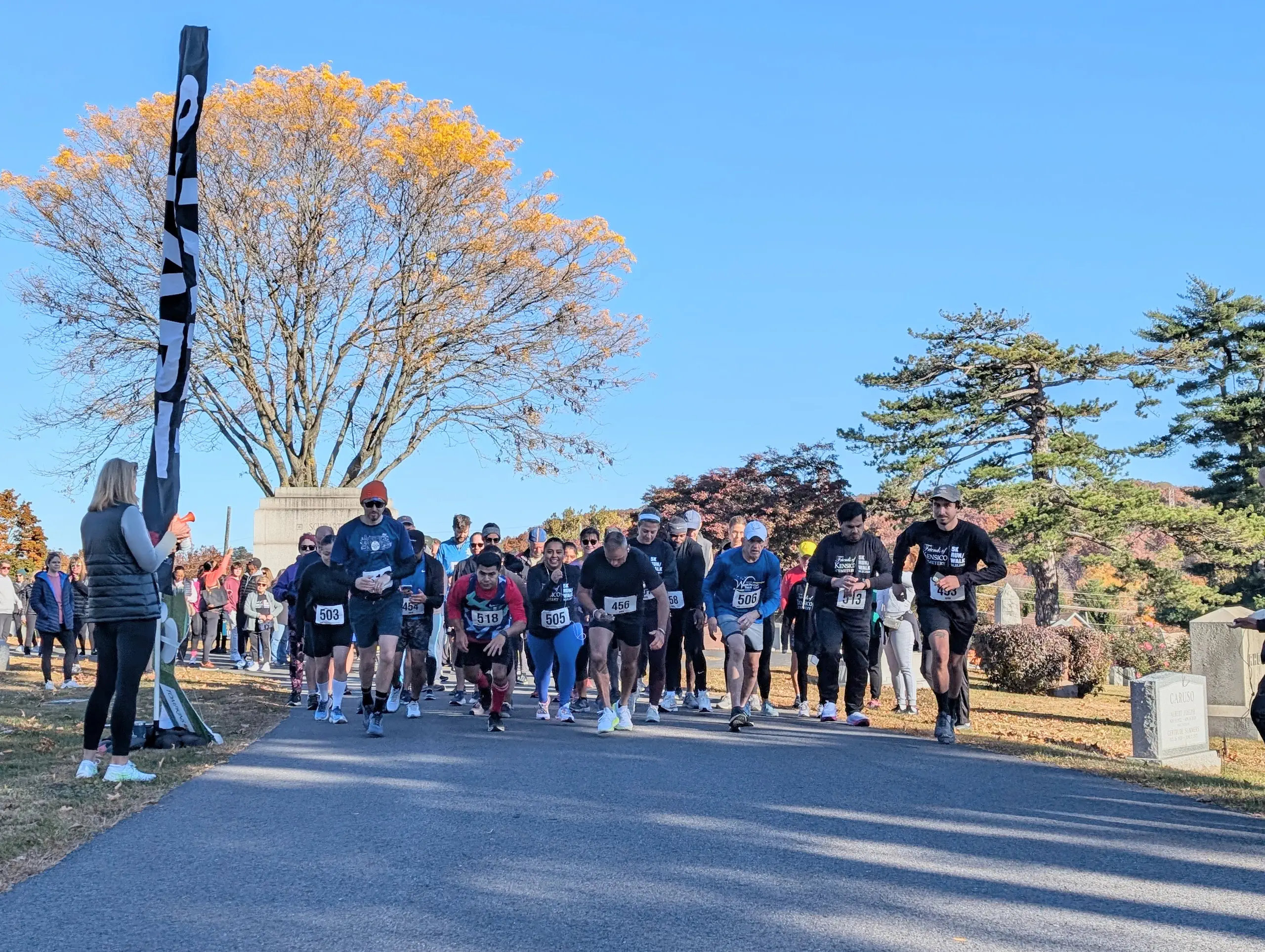 Main 5K Photo Pathway with mausoleums surrounded by trees with leaves changing color for autumn